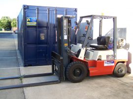 AGB 's forklift is patiently waiting to do the heavy lifting of Storage Crates or any pallets of goods